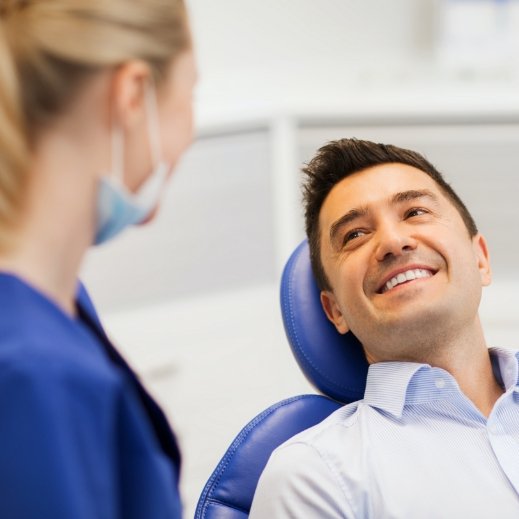 Man smiling after receiving metal free dental restorations