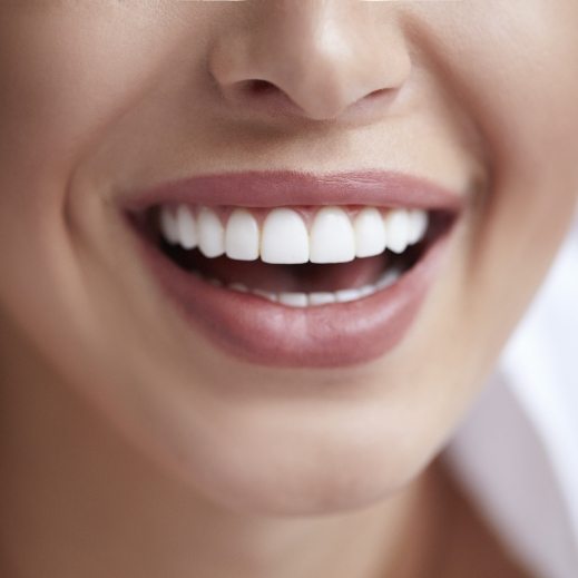 Closeup of health smile benefiting from tooth replacement with dental implants